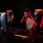 Excited gamer immerses in thrilling video game. Engrossed in a competitive session.