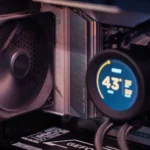 Close-up of a gaming PC build showcasing GPU, fan, and liquid cooling system.